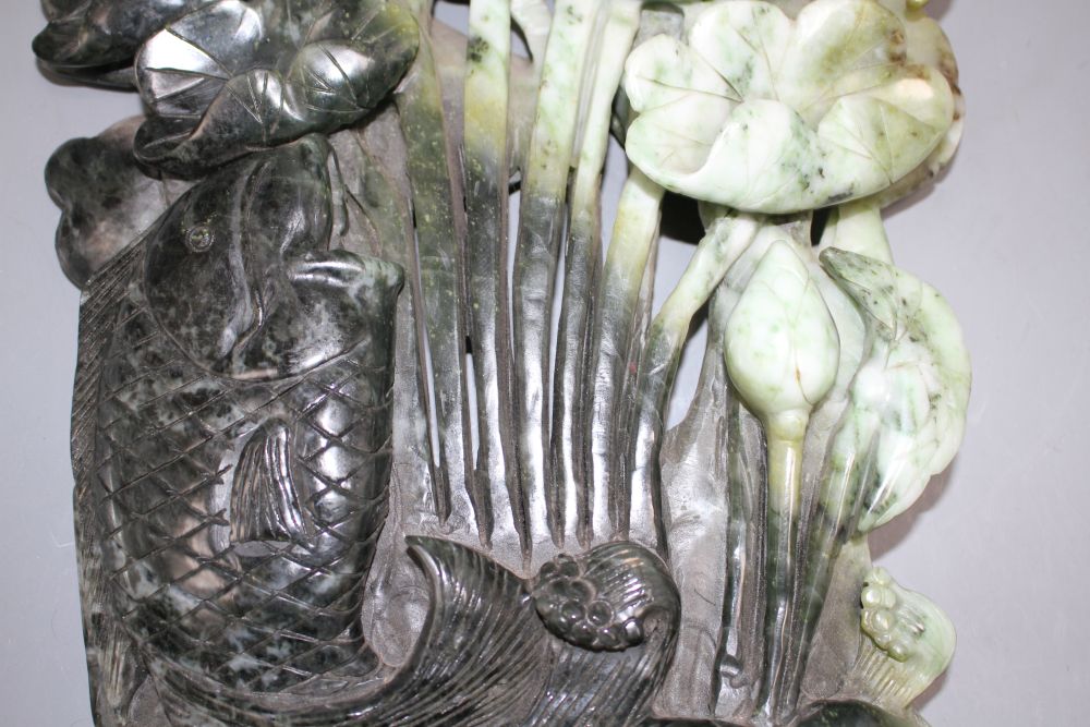 A Chinese carved jadeite group of a leaping carp and lotus flowers, height 30cm